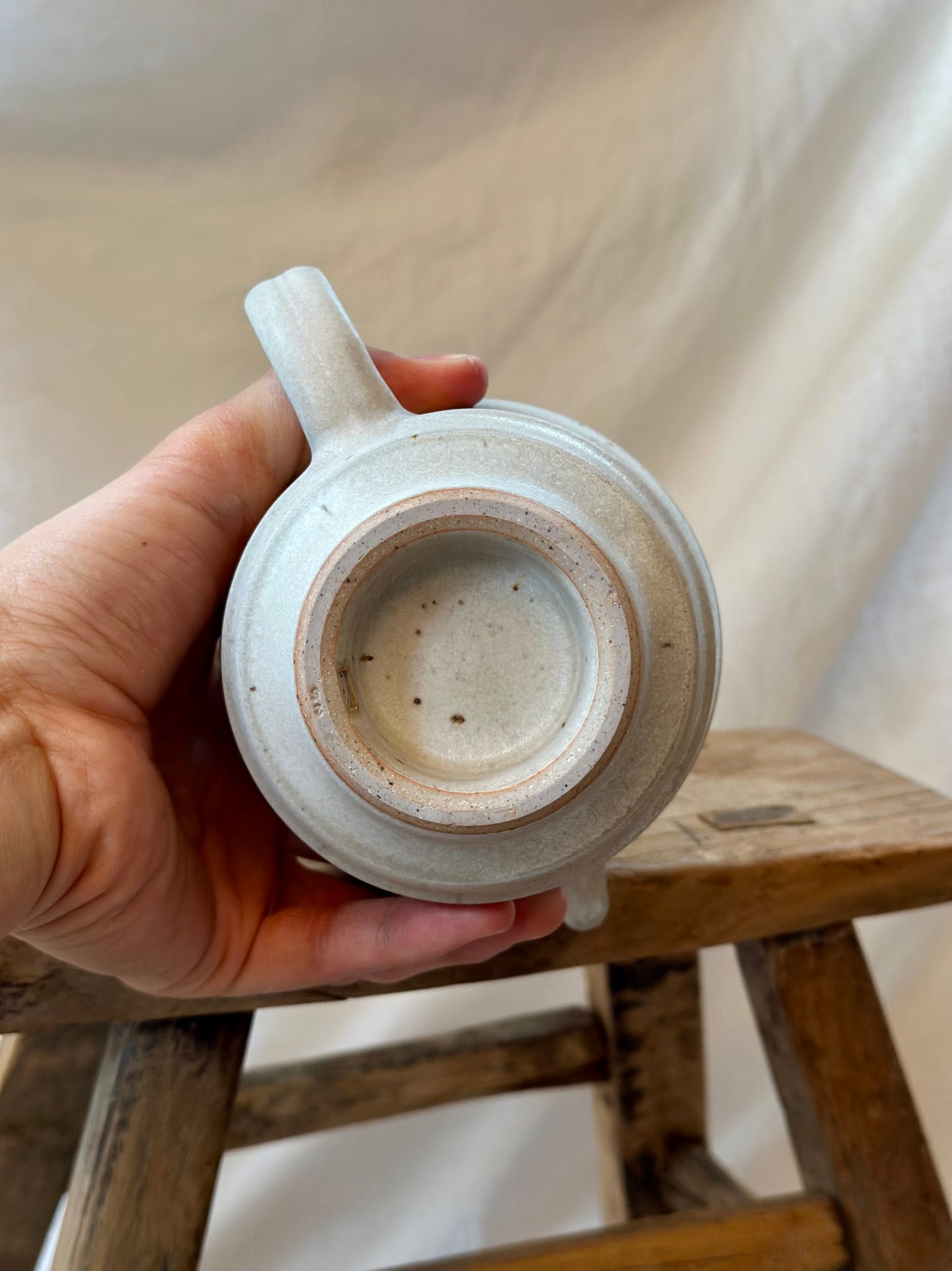 Antique white revolve teapot