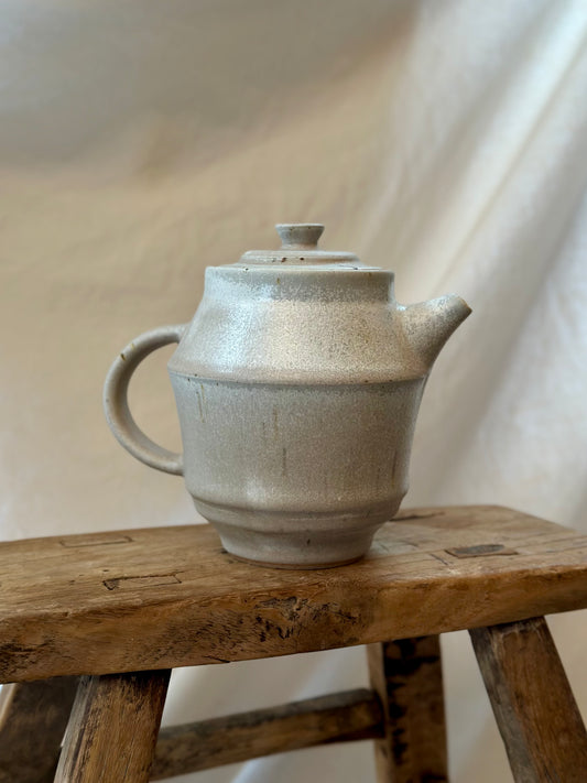 Antique white revolve teapot
