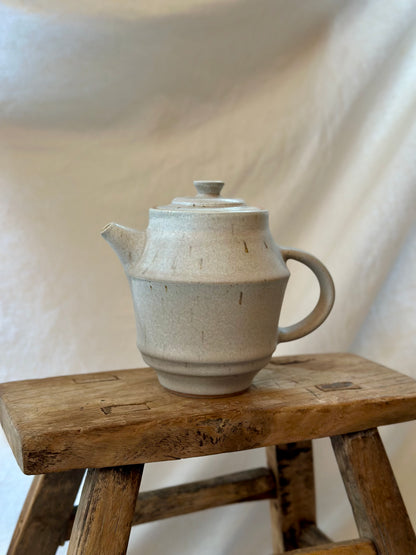 Antique white revolve teapot