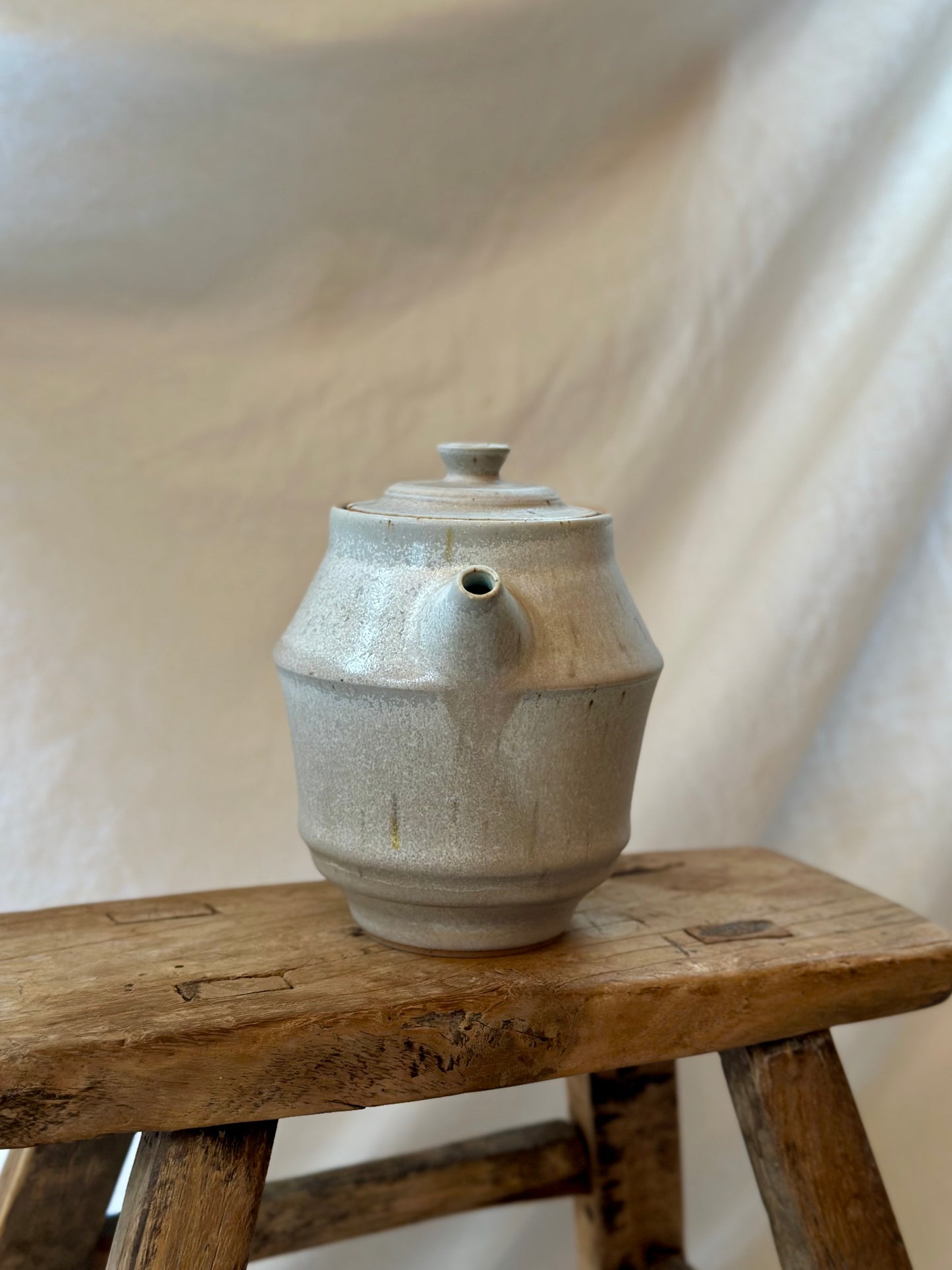 Antique white revolve teapot