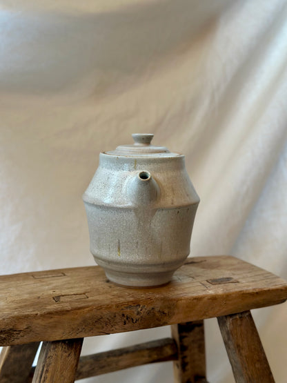 Antique white revolve teapot