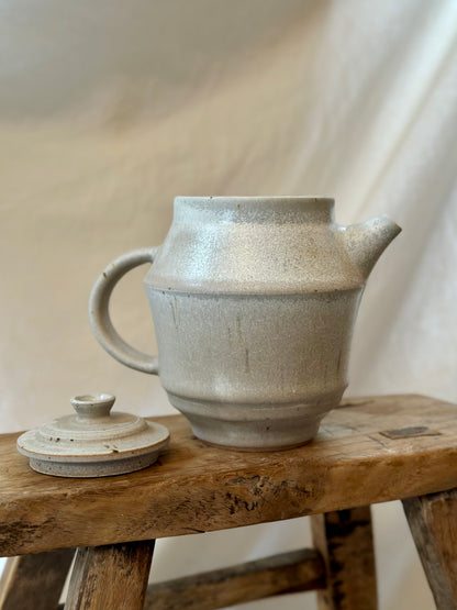 Antique white revolve teapot