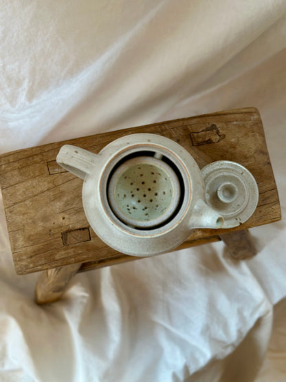Antique white revolve teapot