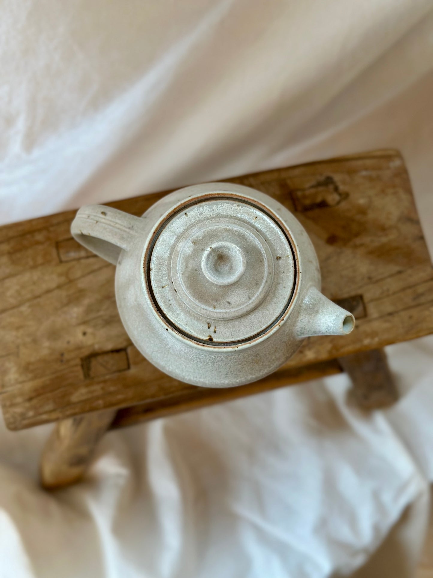 Antique white revolve teapot