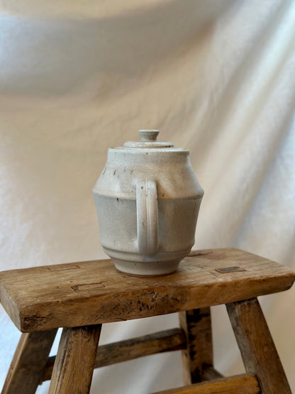 Antique white revolve teapot
